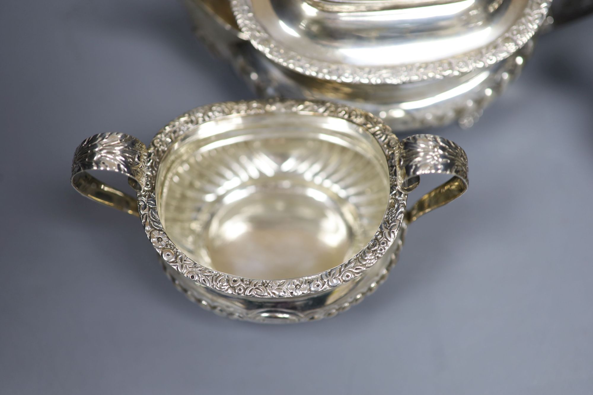 A late Victorian demi fluted silver three piece tea set, Charles Stuart Harris, London, 1899, gross 25.5oz (a.f.).